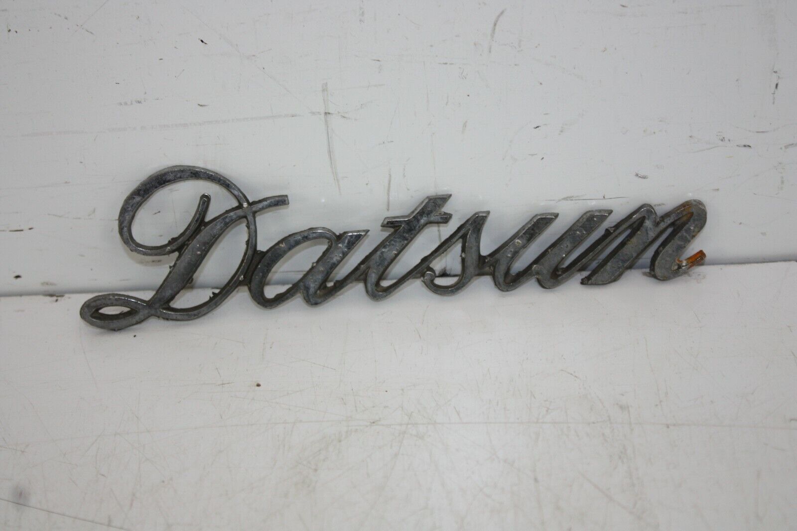 Datsun-Chrome-Italic-Bumper-Badge-Genuine-175458680936